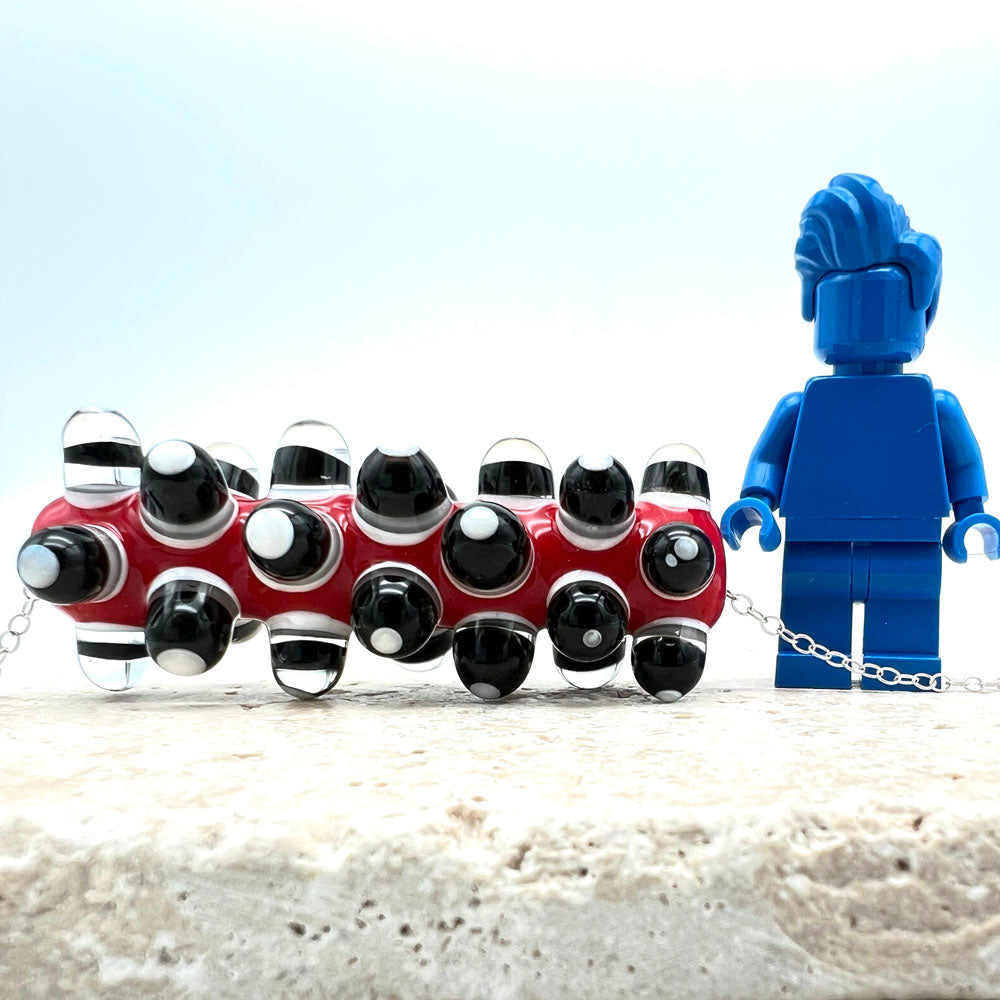 Bead shown with Lego figure for scale. The height of the bead is just above the elbow of the figure.