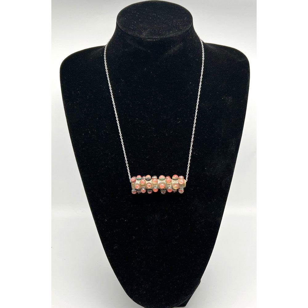 Black velvet bust displaying the blossom raised dot necklace.