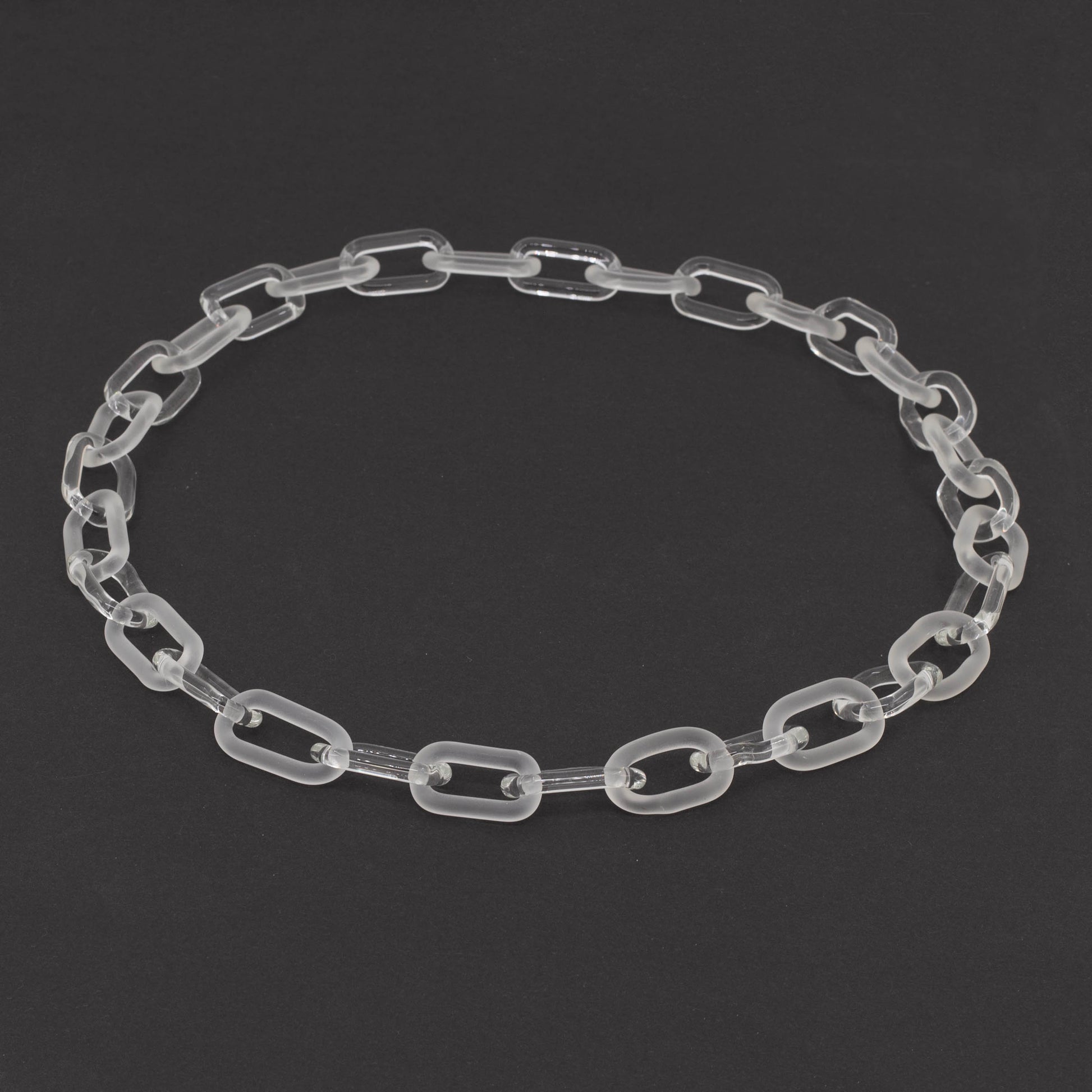 glass necklace made with bold links of alternating clear and frosted glass