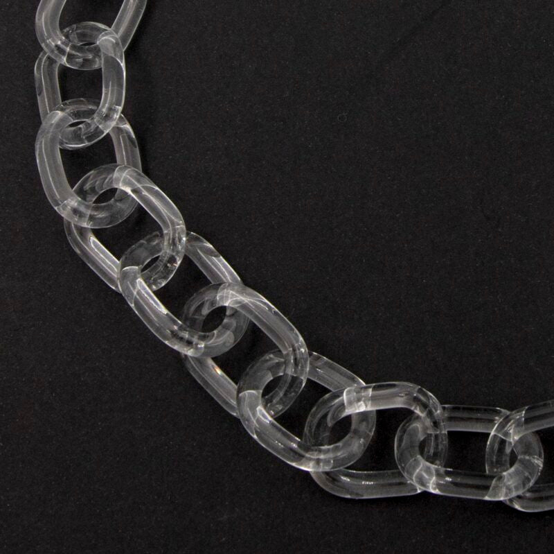 Close up of clear glass necklace made with bold links