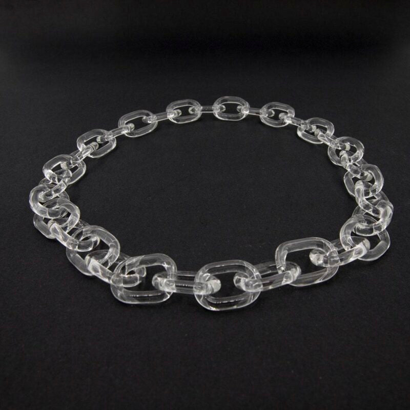 clear glass necklace made with bold links, photographed on dark background