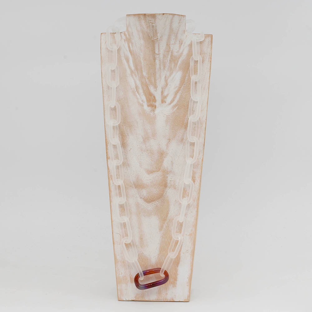Front view of whitewashed wood torso displaying a frosted clear glass chain with single multicolour mai tai glass link