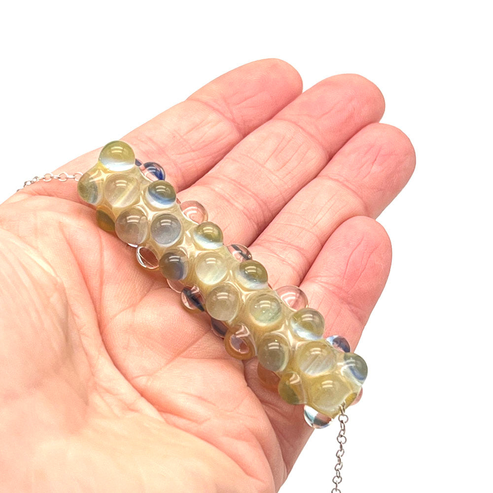 Lemonade bead necklace shown in the palm of a hand.