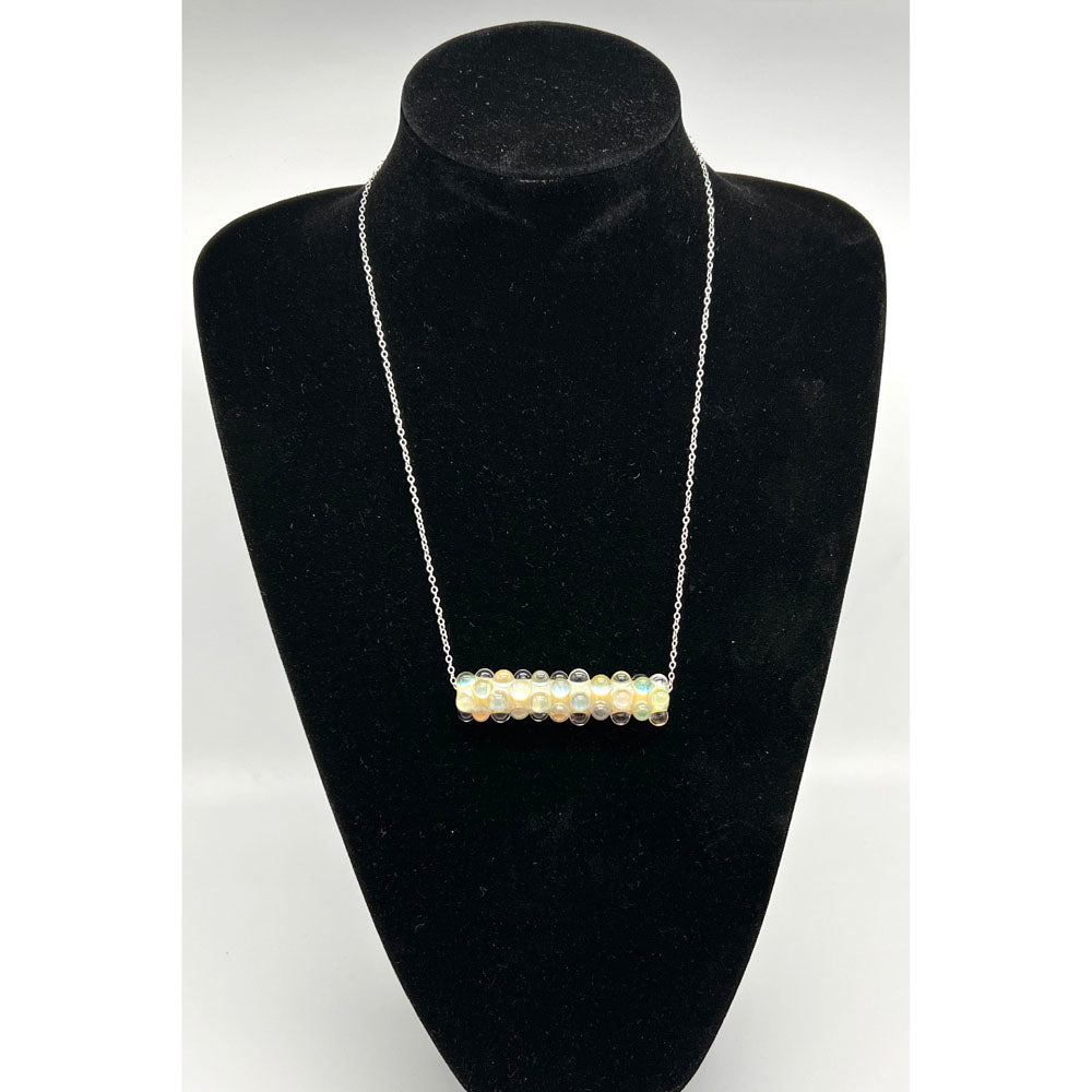 Black velvet bust wearing the lemonade bead necklace.