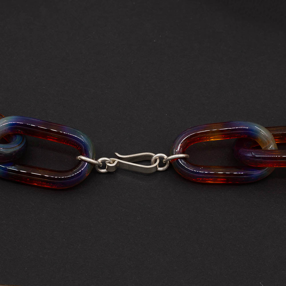 Close up of chunky sterling silver clap on mai tai glass chain