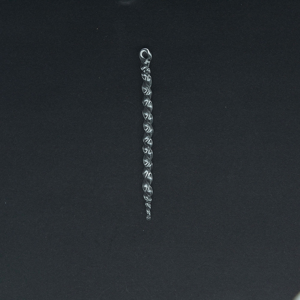 A medium clear glass icicle made from thin glass rod with twists along its lebgth and a hanging loop.