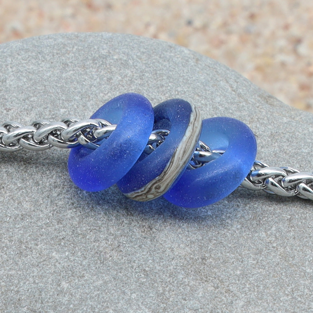 Bracelet with 3 Frosted Mid Blue Transparent Glass Beads