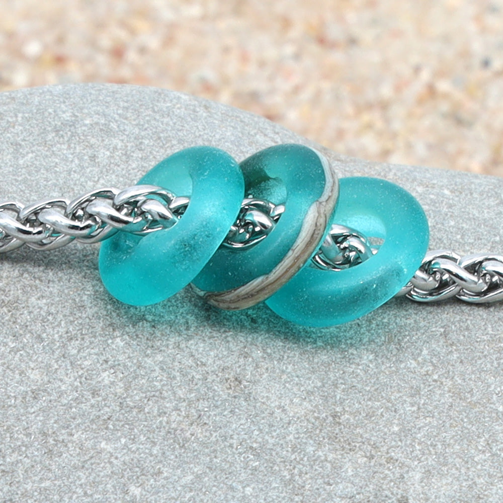 Bracelet with 3 Frosted Teal Transparent Glass Beads