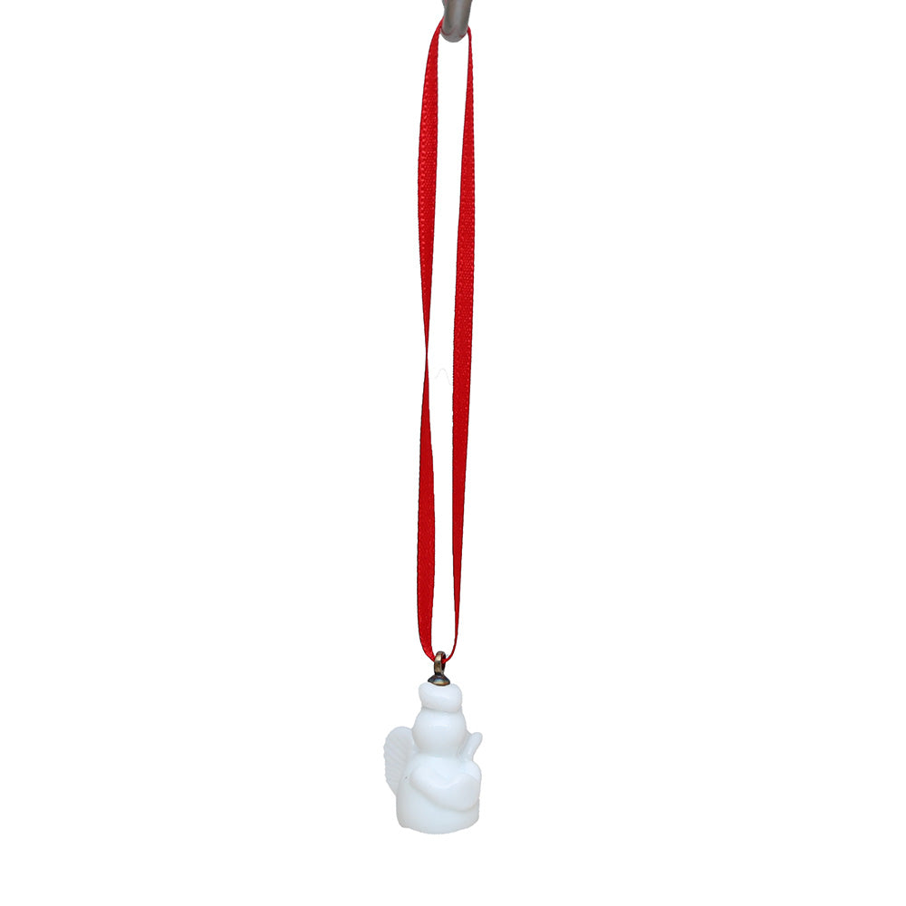 Tiny white glass angel decoration on a red ribbon.