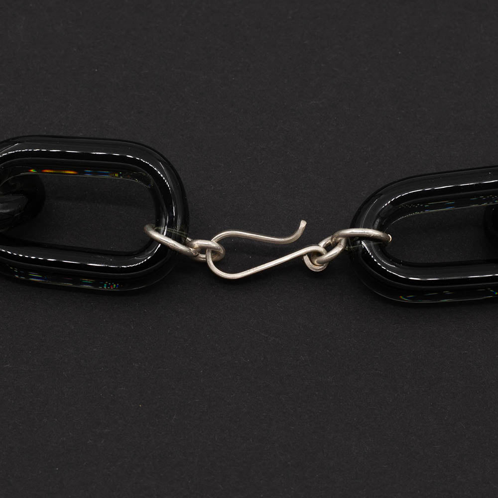 Close up of chunky sterling silver loop and hook catch