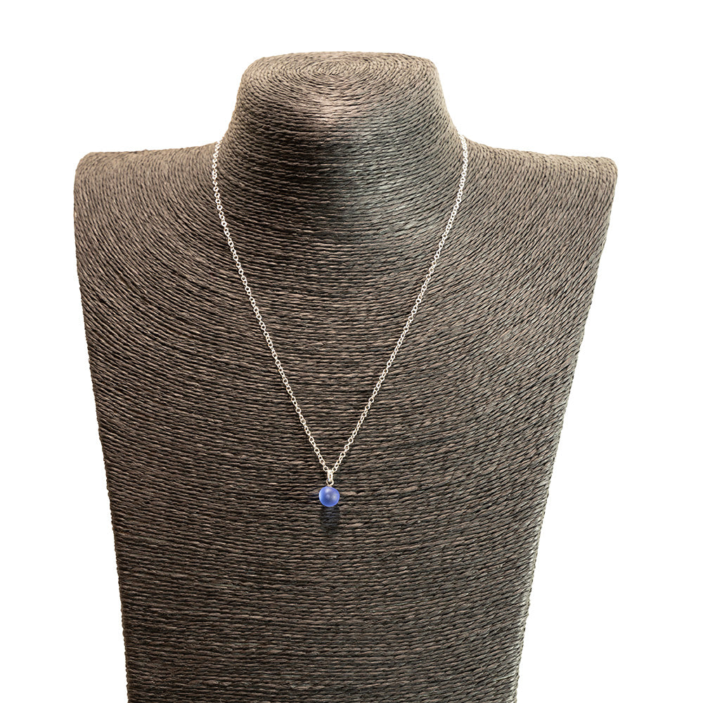 blue frosted glass ball charm necklace with sterling silver chain shown on a black mannequin bust