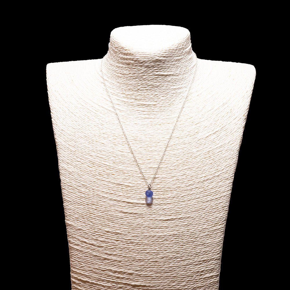 blue glass ball charm necklace with sterling silver chain shown on a white mannequin bust