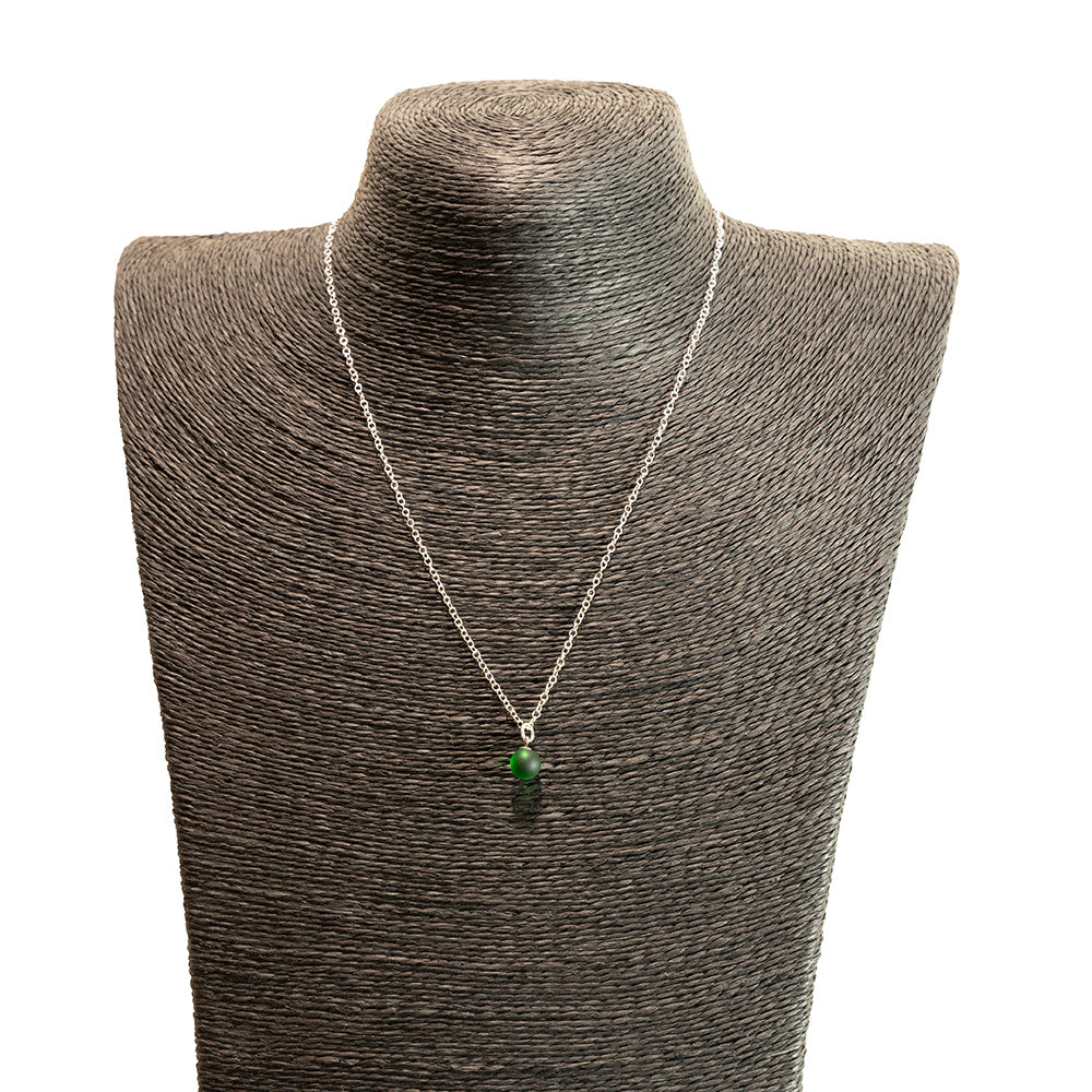 green frosted glass ball charm necklace with sterling silver chain shown on a black mannequin bust