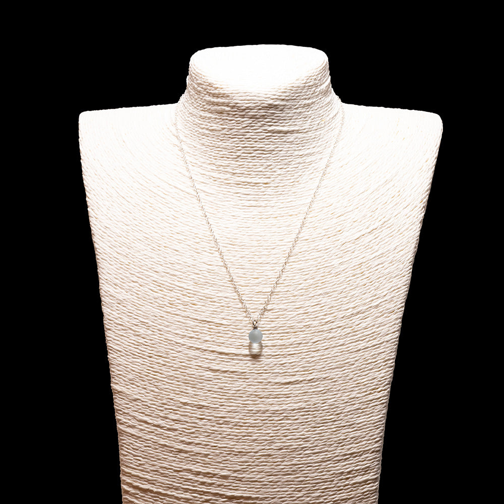 pale blue glass ball charm necklace with sterling silver chain shown on a white mannequin bust