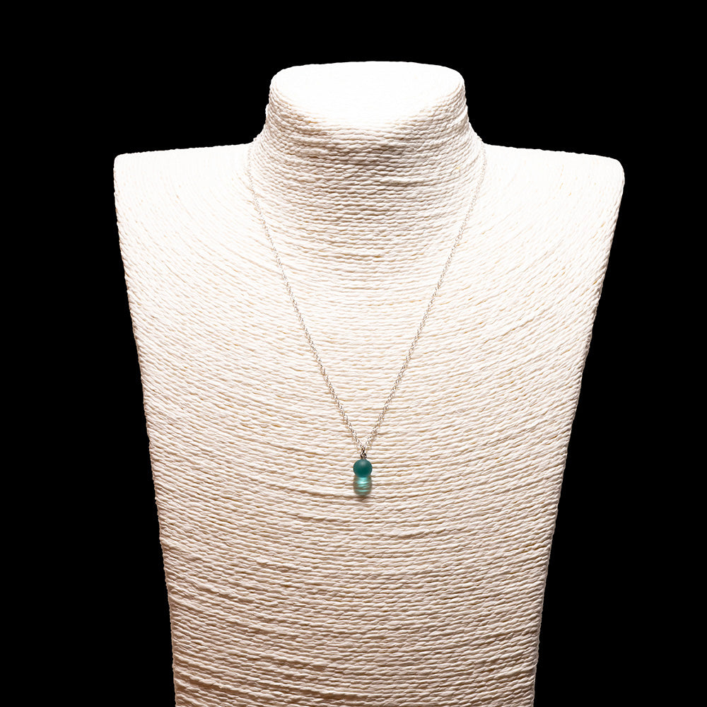 teal glass ball charm necklace with sterling silver chain shown on a white mannequin bust