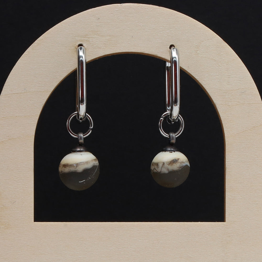 Frosted Black and Ivory Glass Oval Hoop Earrings