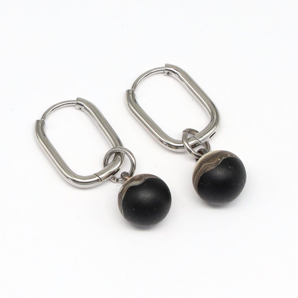 Frosted Black and Ivory Glass Oval Hoop Earrings