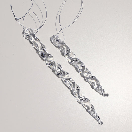 Two cleat glass icicles in long amd medium lengths with zig zag twists along their length.