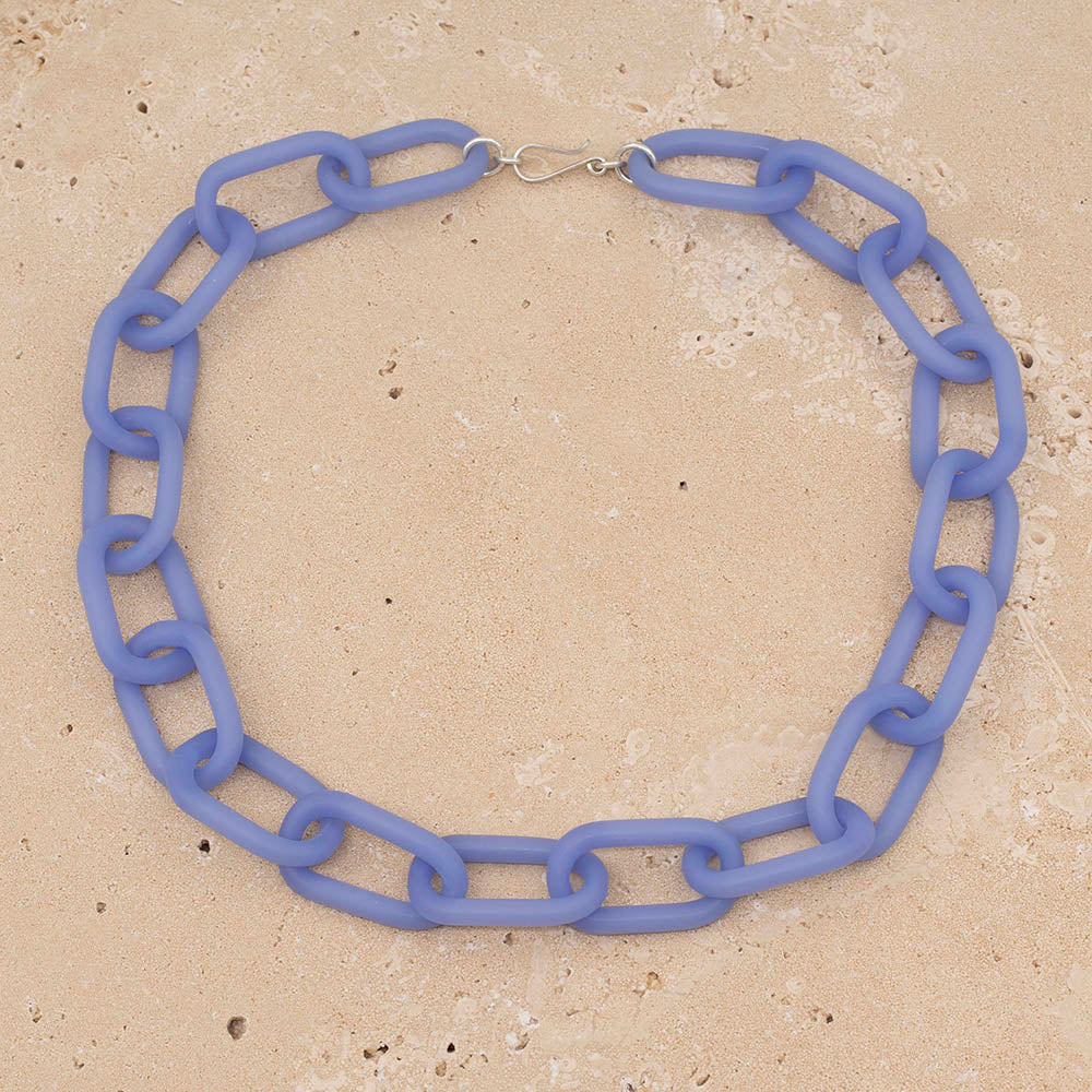 A necklace made from pale blue frosted glass links with silver hook and eye fastening