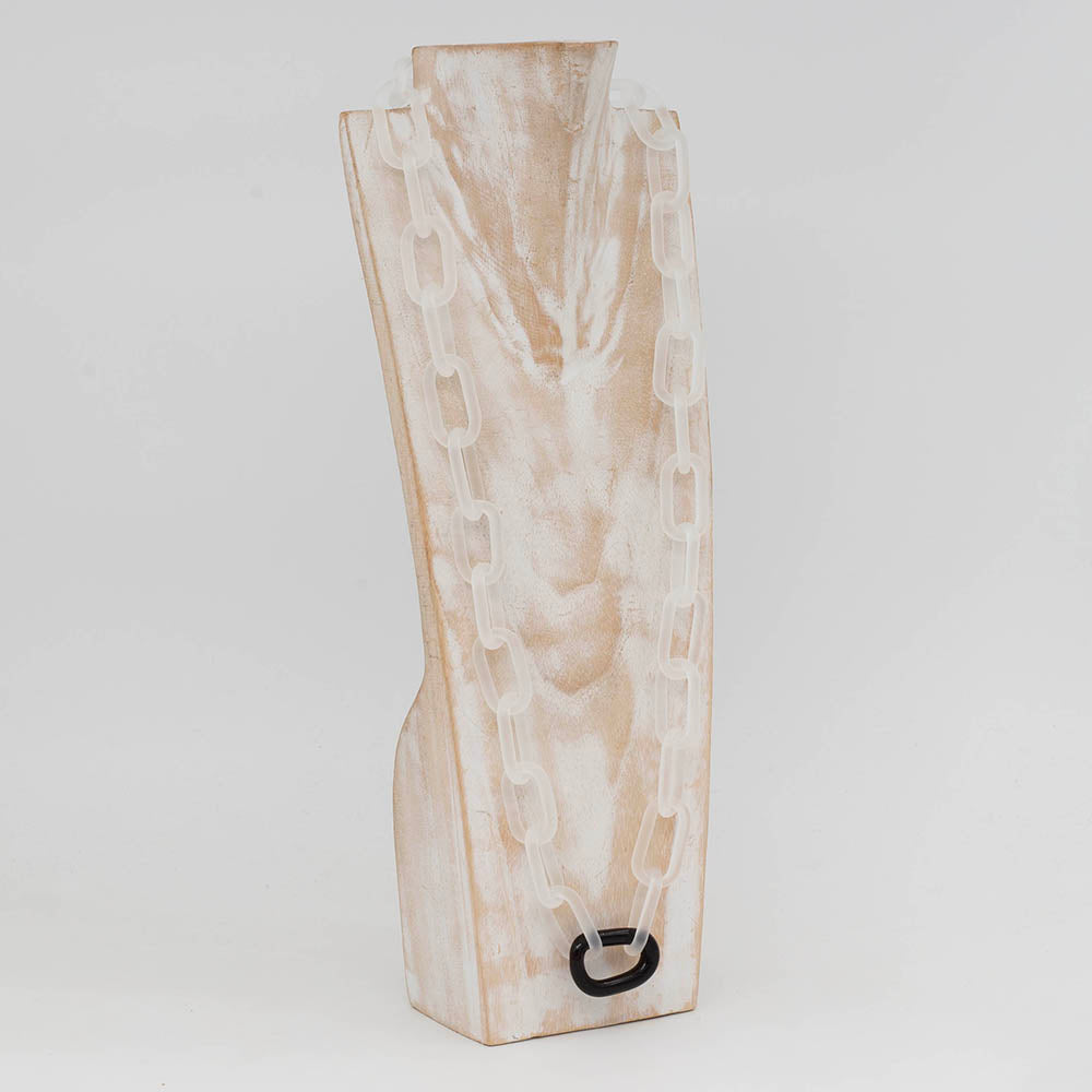 Side view of whitewashed wood torso displaying a clear frosted glass chain necklace with a single shiny glass link