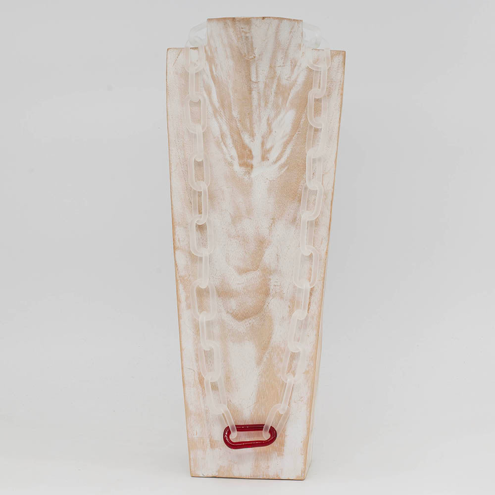 front view of whitewashed wood torso displaying clear frosted glass chain with single red link