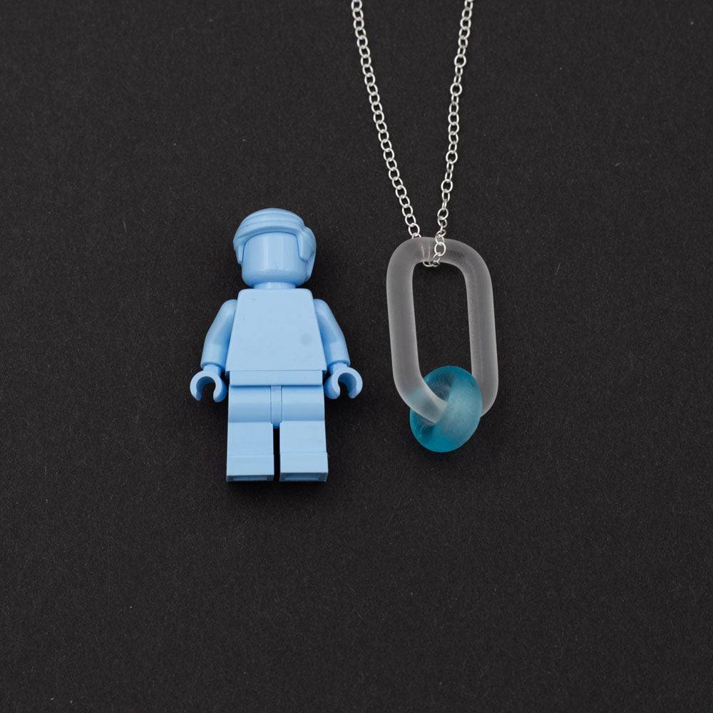 Lego figure with a necklace with link and Bombay Sapphire gin bottle bead