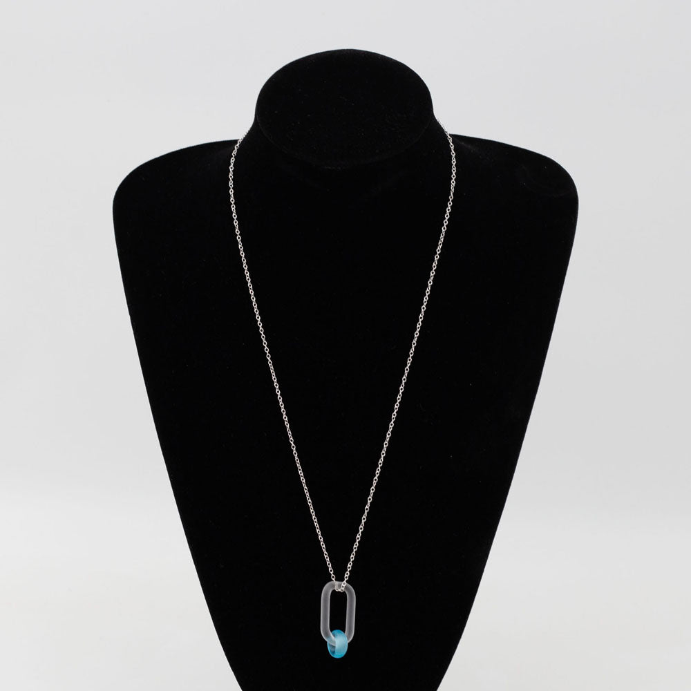 Black velvet bust displaying a necklace with link and Bombay Sapphire gin bottle bead