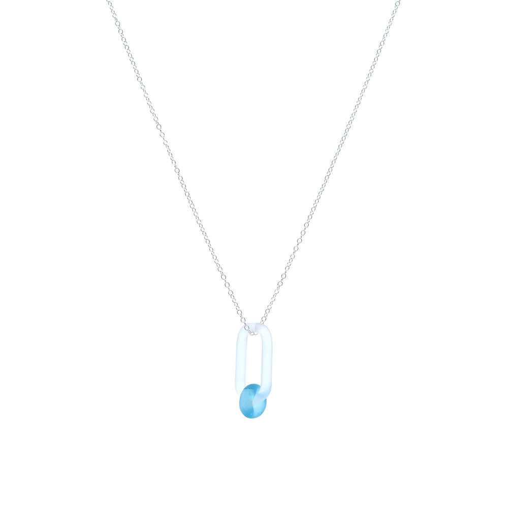 Frosted clear glass link. The link is oval and passes through a bead made from turquoise Bombay Sapphire gin bottle glass, The link hangs from a sterling silver chain.