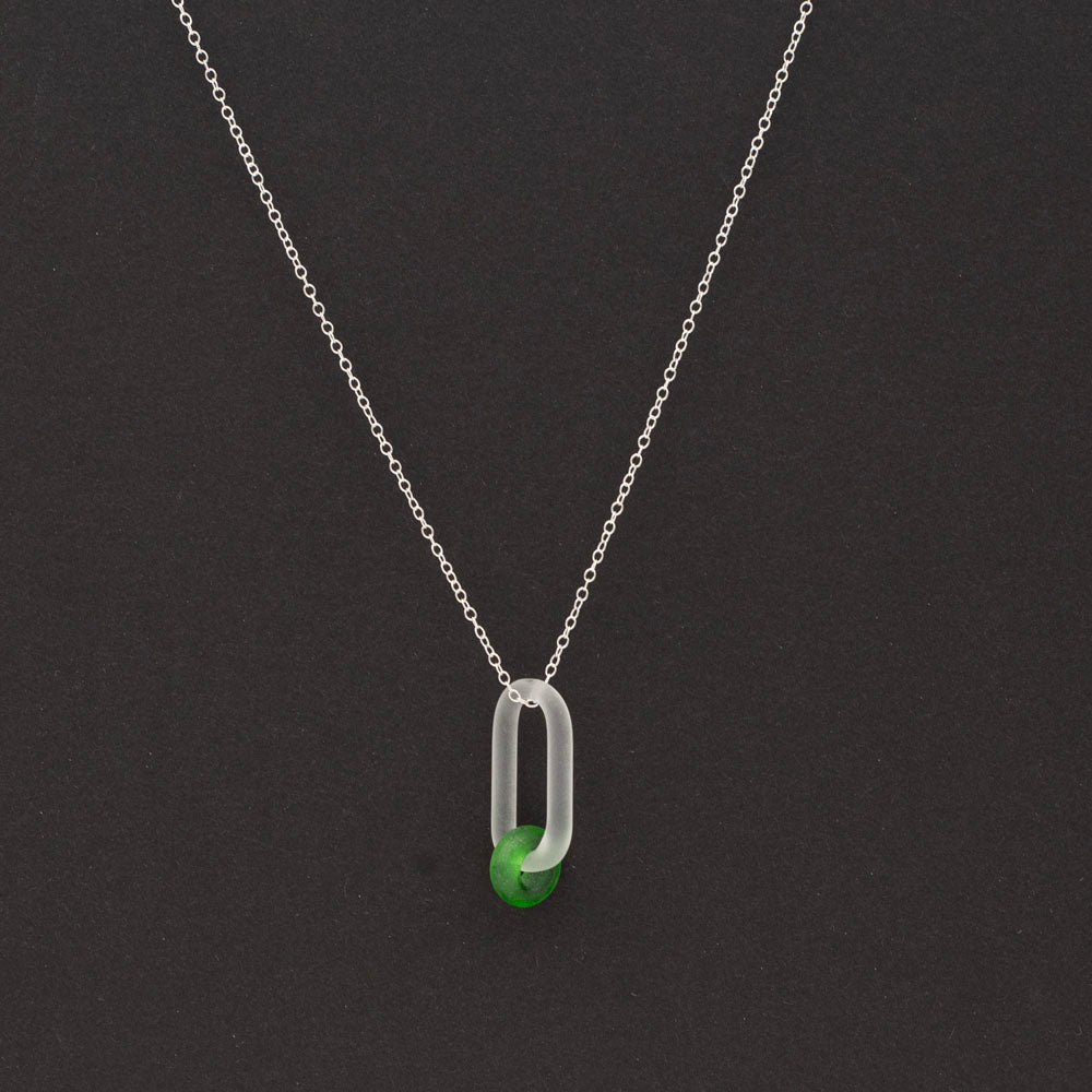 Dark background, frosted clear glass link and green gin bottle glass bead necklace.