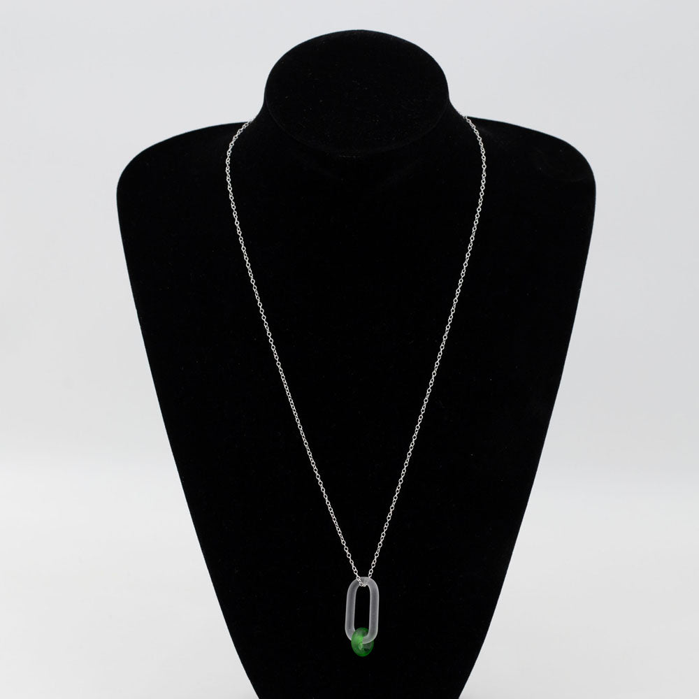 Black velvet bust displaying frosted clear glass link and green gin bottle glass bead necklace.