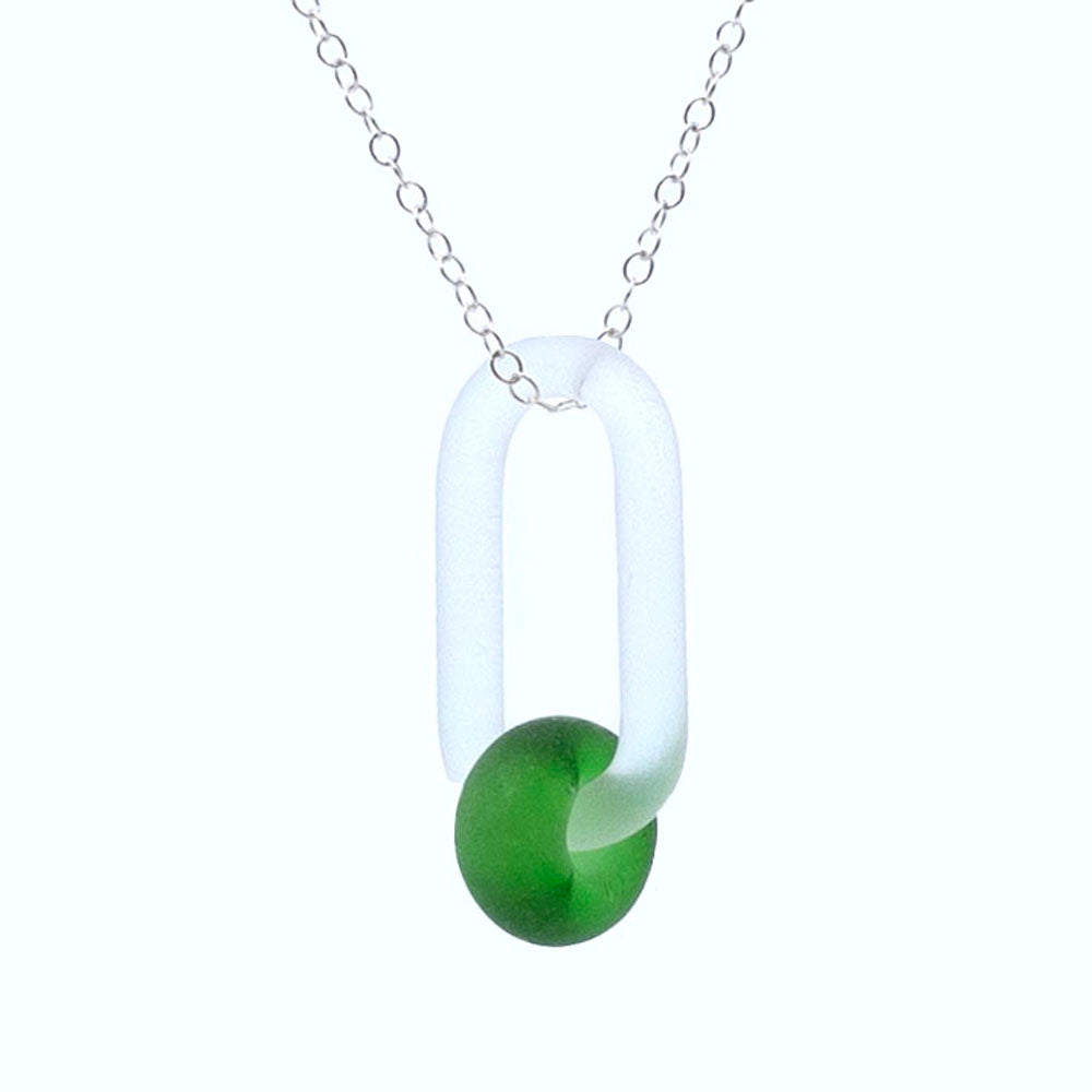 Close up of  frosted clear glass link and green gin bottle glass bead necklace.