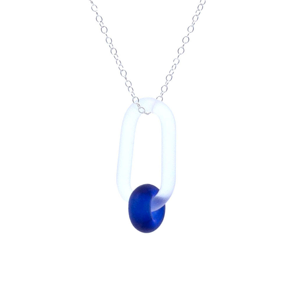 Frosted clear glass link necklace. The link passes through a bead made form recycled blue sherry bottle glass, and the bead has a frosted finish. The link hangs from a sterling silver chain.