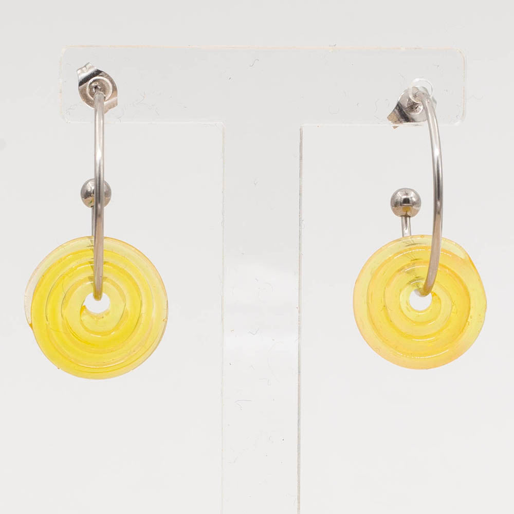 Front view of a pair of stainless steel hoop earrings with yellow glass disc beads