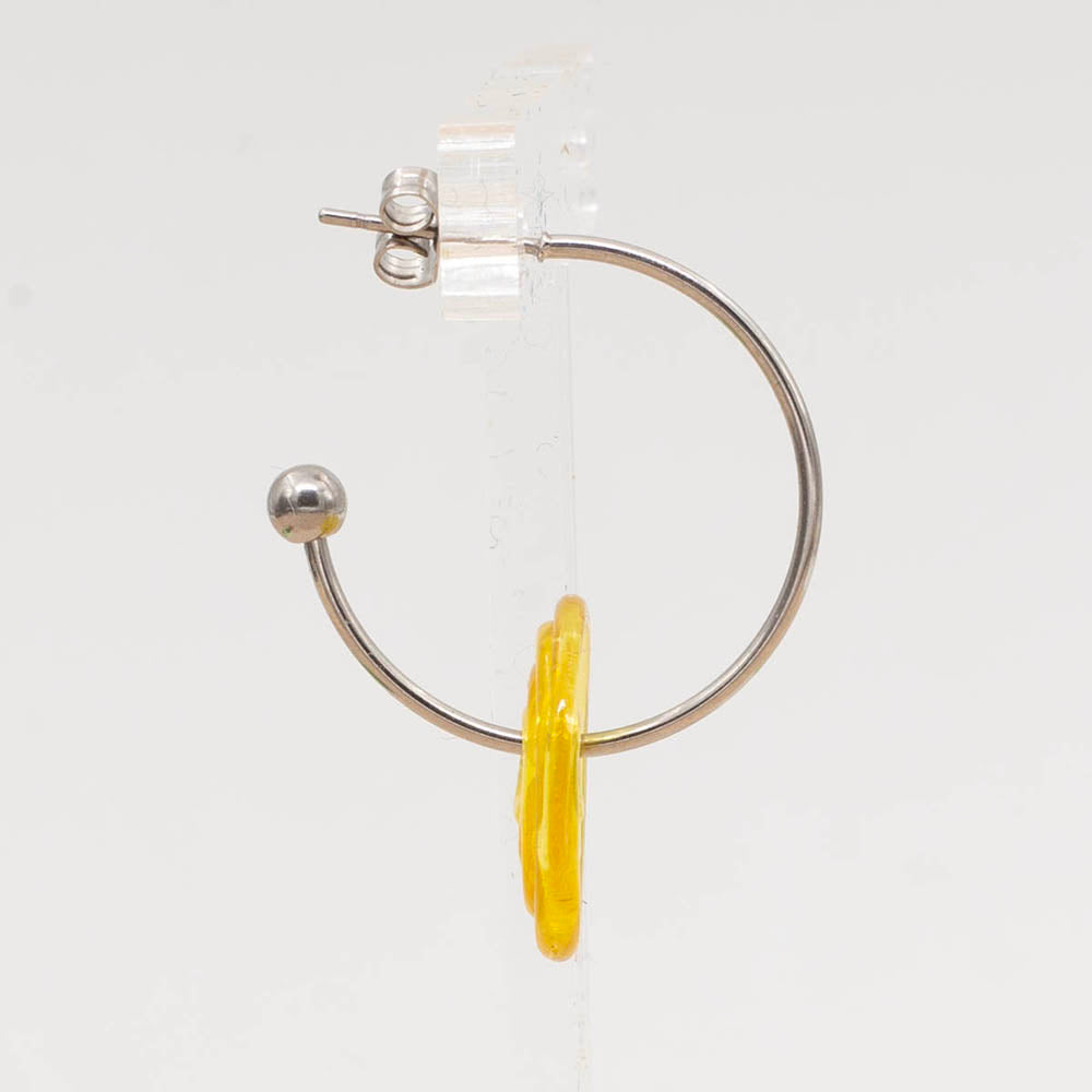 Side view of hoop earring with yellow disc bead