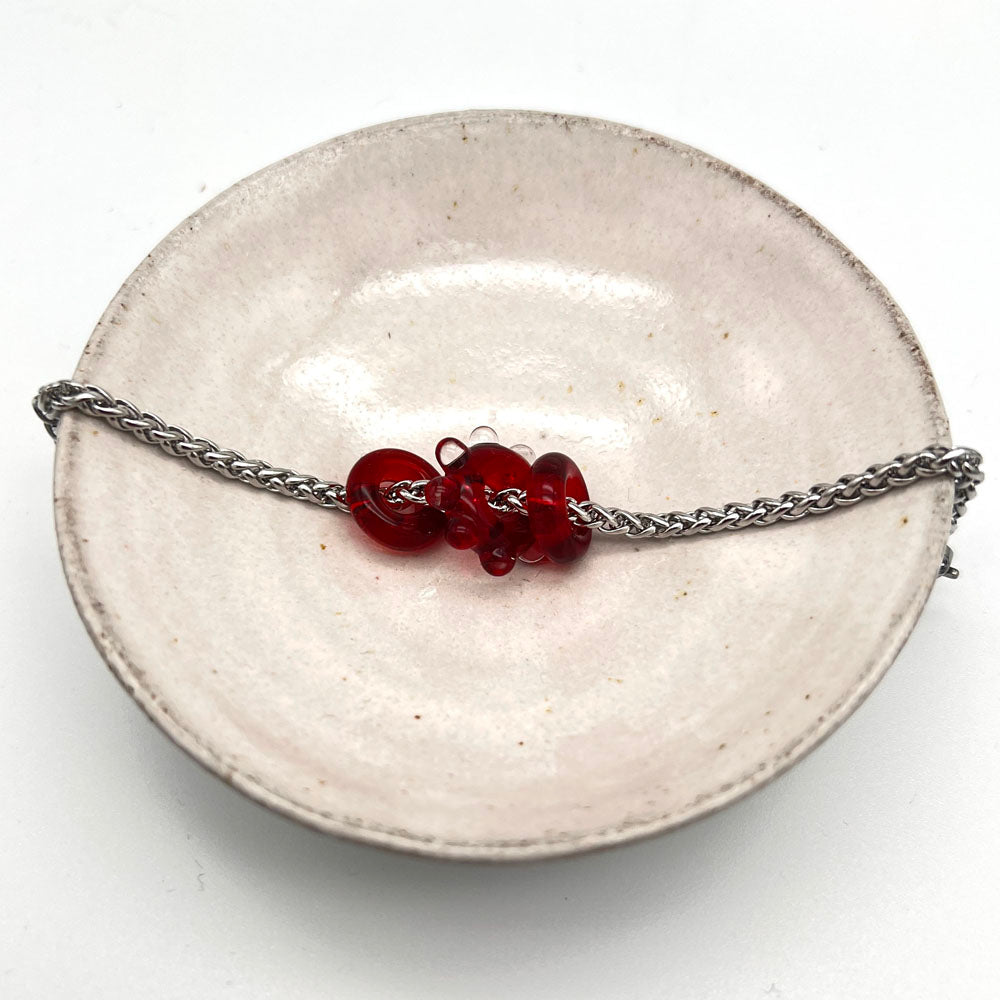 Bracelet with 3 red water droplet glass beads