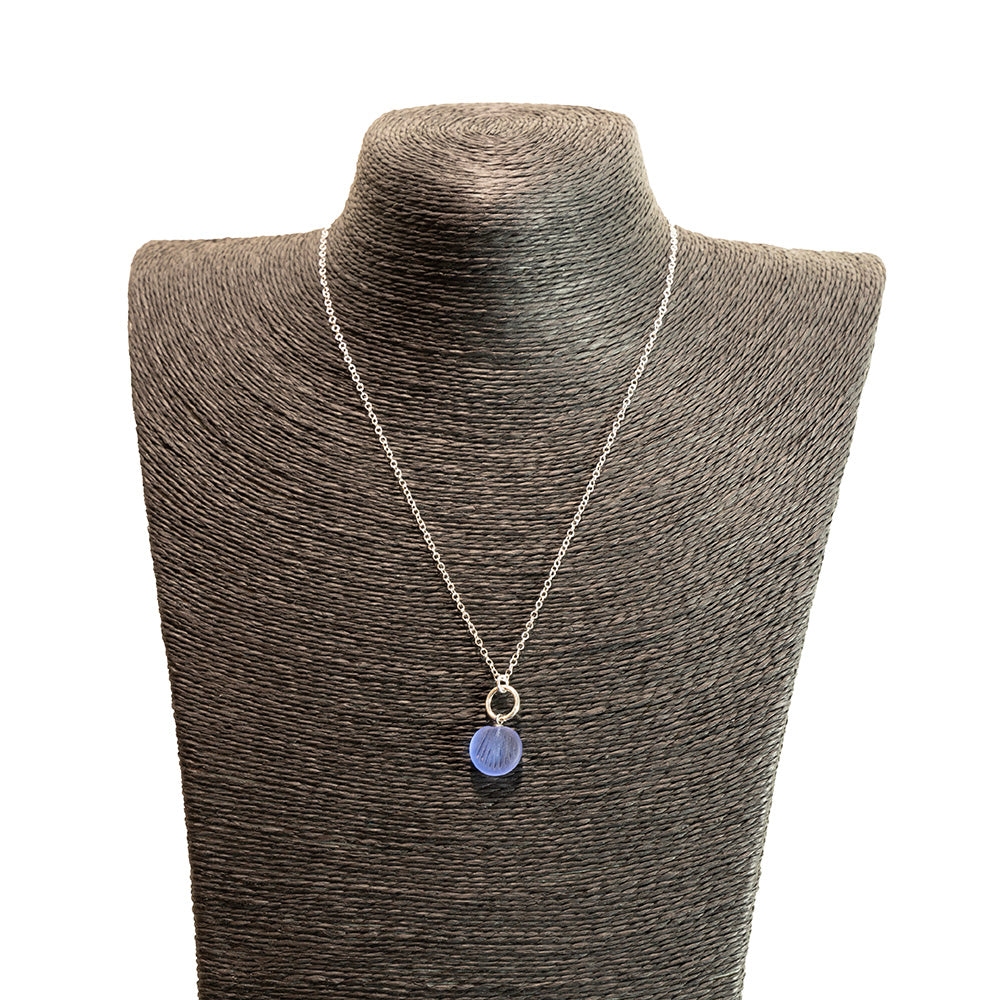 blue glass shell imprint charm necklace with sterling silver chain shown on a black mannequin bust