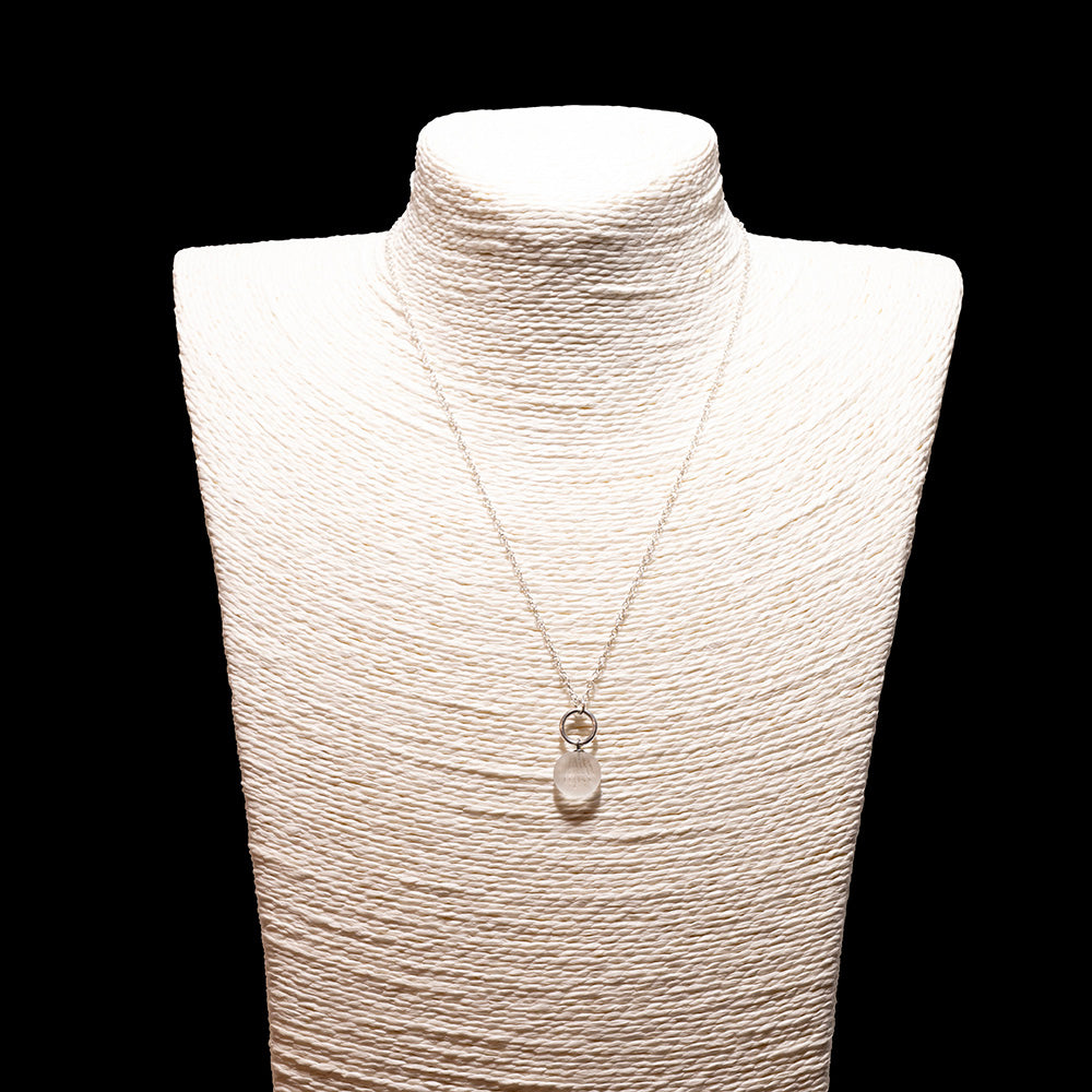 clear frosted glass shell imprint charm necklace with sterling silver chain shown on a white mannequin bust