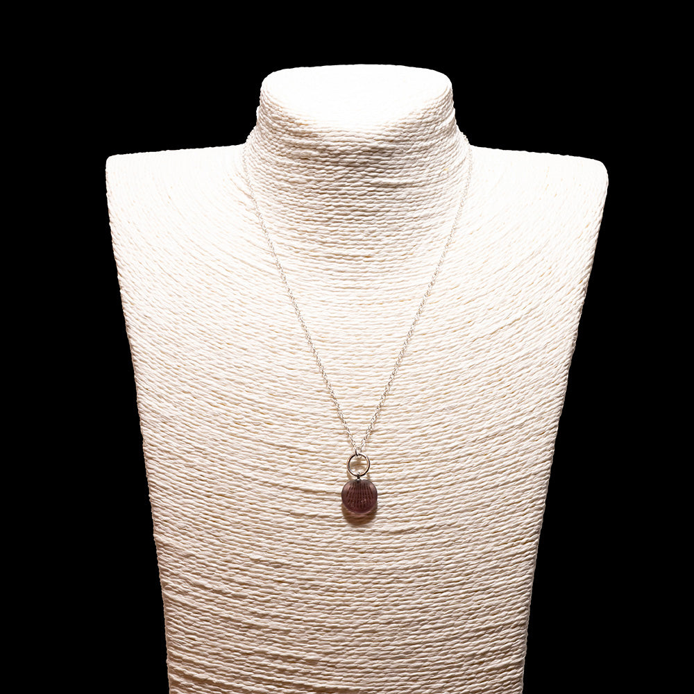 purple frosted glass shell imprint charm necklace with sterling silver chain shown on a white mannequin bust