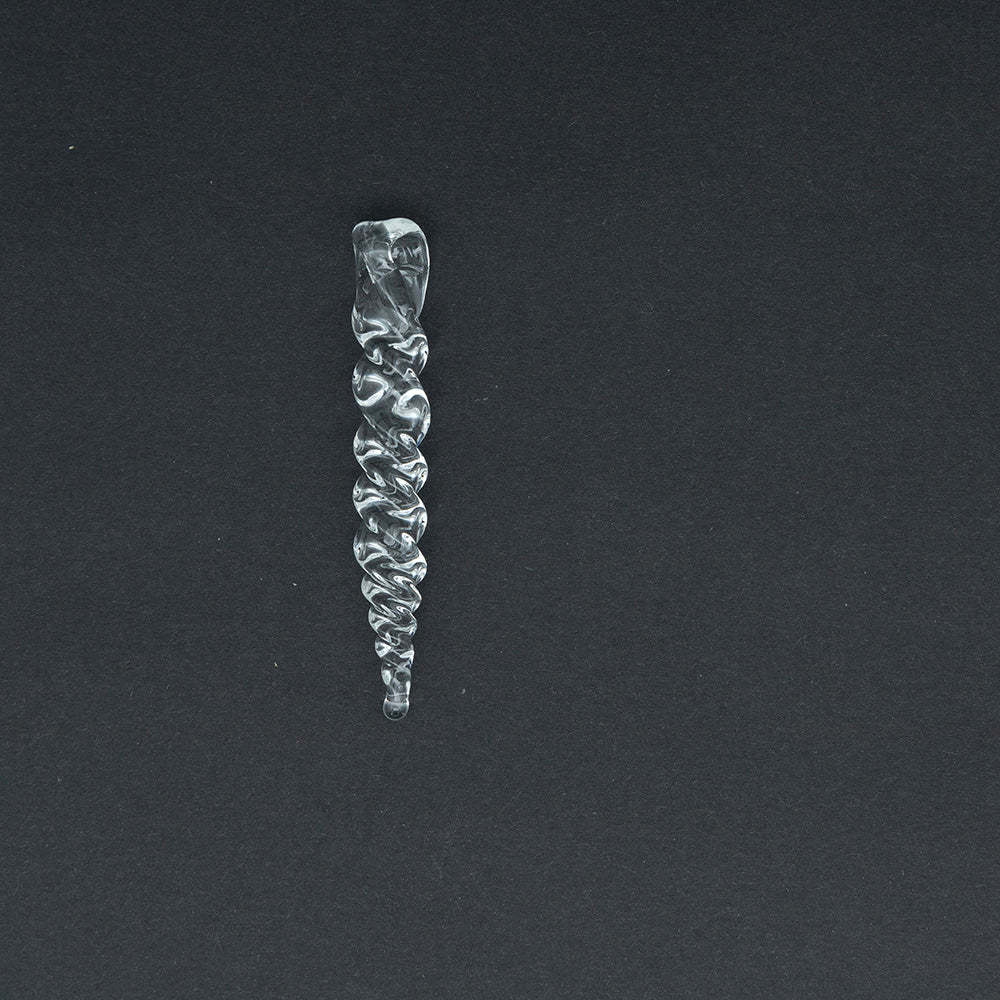 A small glass icicle smade from chunky glass rod.   The icicle twists along its length and has a hanging loop.