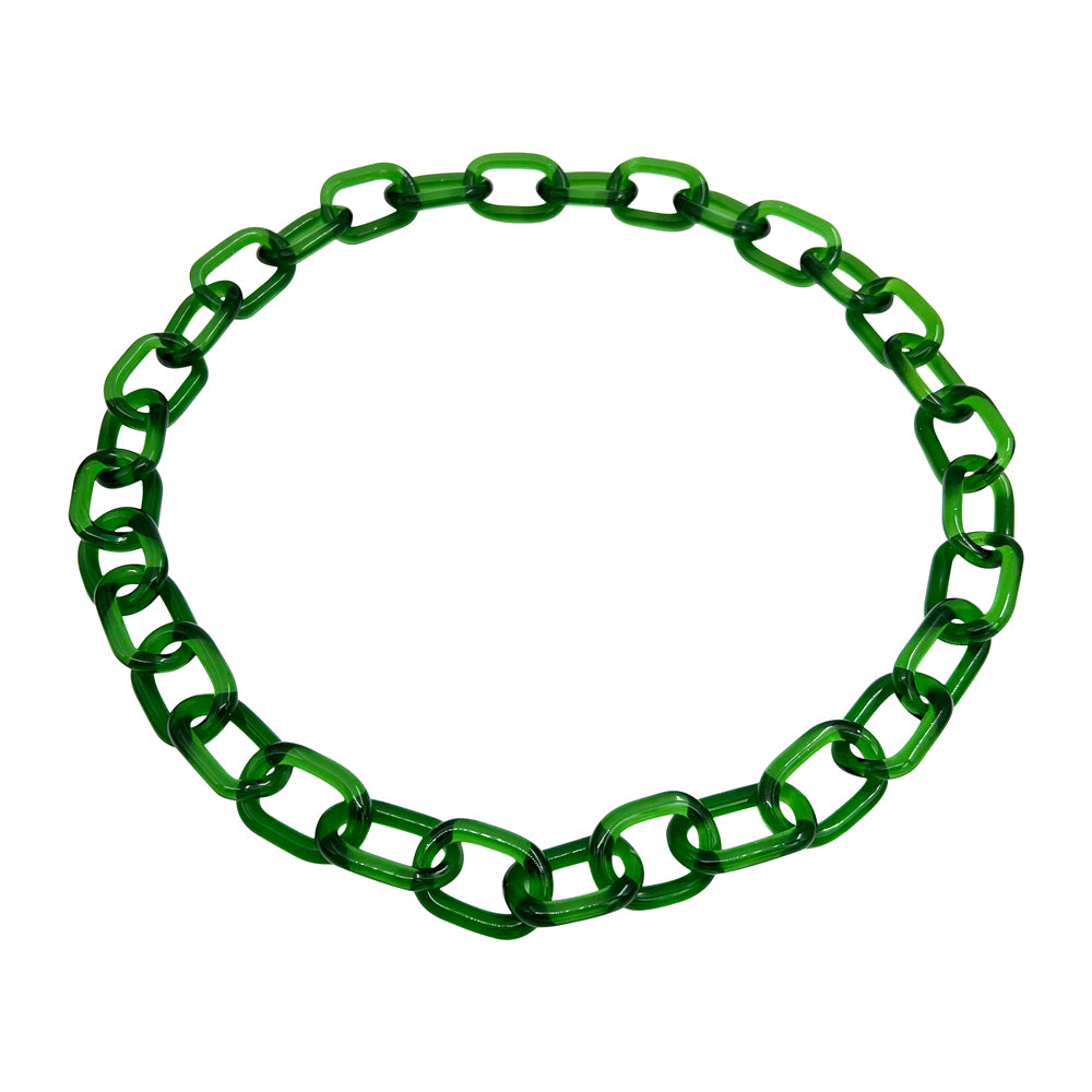 Glass chain link necklace made with transparent green glass. The necklace is made up of 32 links so it can pass over the head without needing a catch. The necklace is laid flat on a white background.