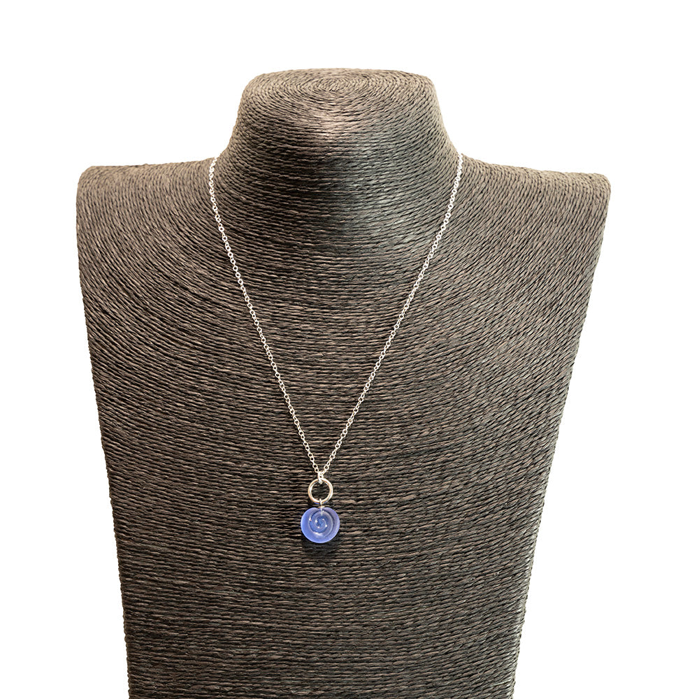 blue swirl charm necklace shown on a black mannequin bust