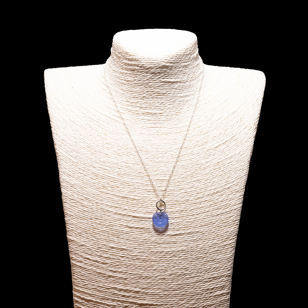 blue glass swirl charm necklace with sterling silver chain shown on a white mannequin bust