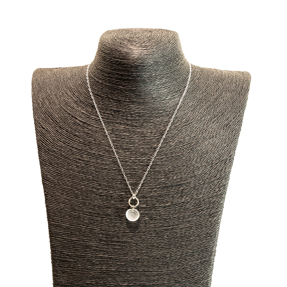 clear swirl charm necklace shown on a black mannequin bust