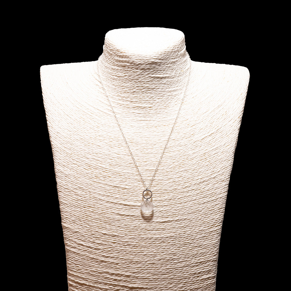 clear glass swirl charm necklace with sterling silver chain shown on a white mannequin bust