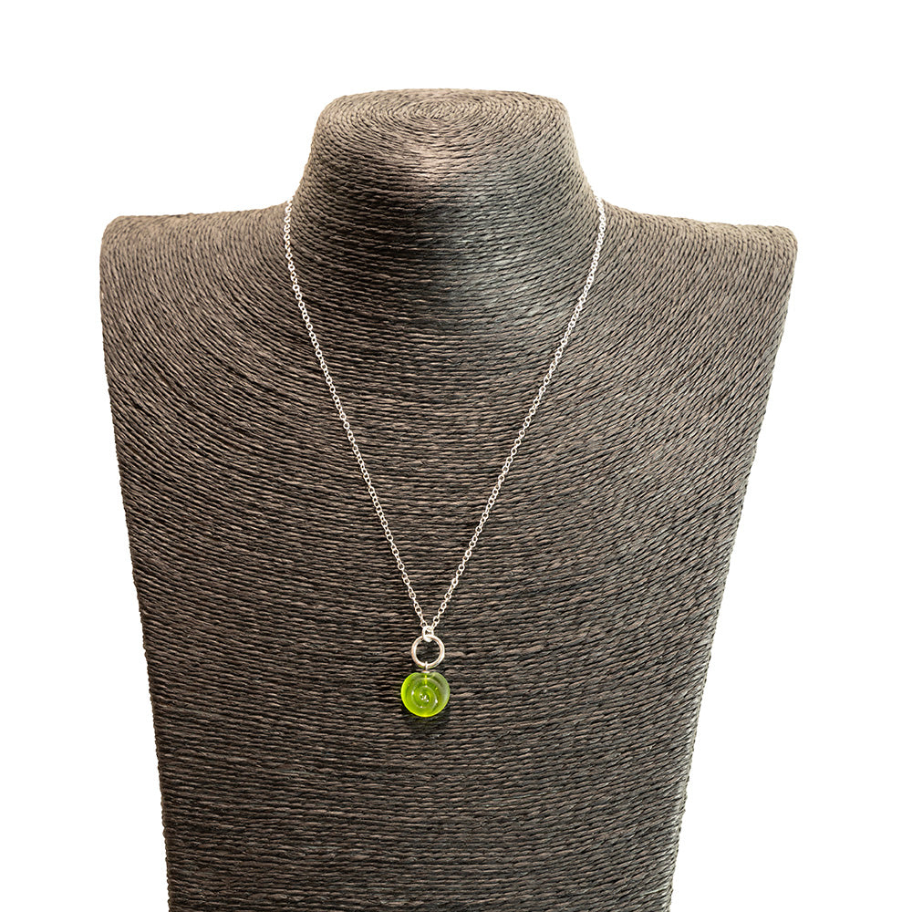 lime swirl charm necklace shown on a black mannequin bust