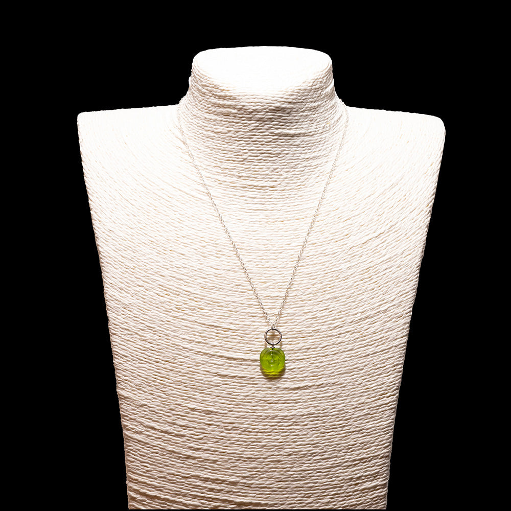 lime glass swirl charm necklace with sterling silver chain shown on a white mannequin bust