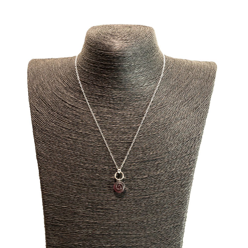 purple swirl charm necklace shown on a black mannequin bust