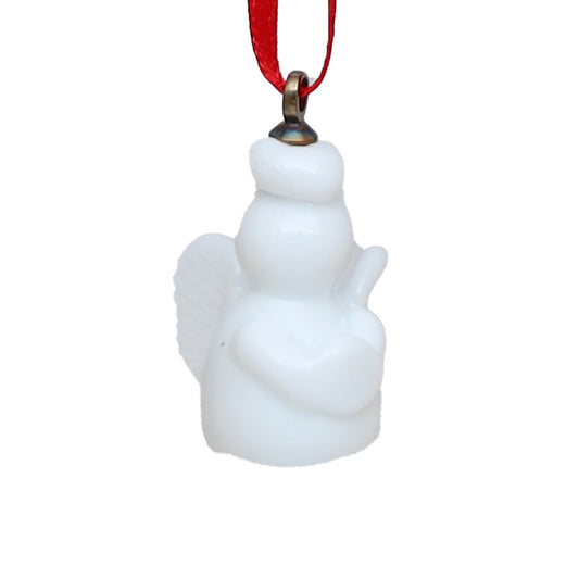 White glass abngel decaoration with folded arms and wings on a red ribbon.