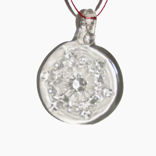 Clear glass snowflake design - a glass disc with a snowflake hanging from a red ribbon.