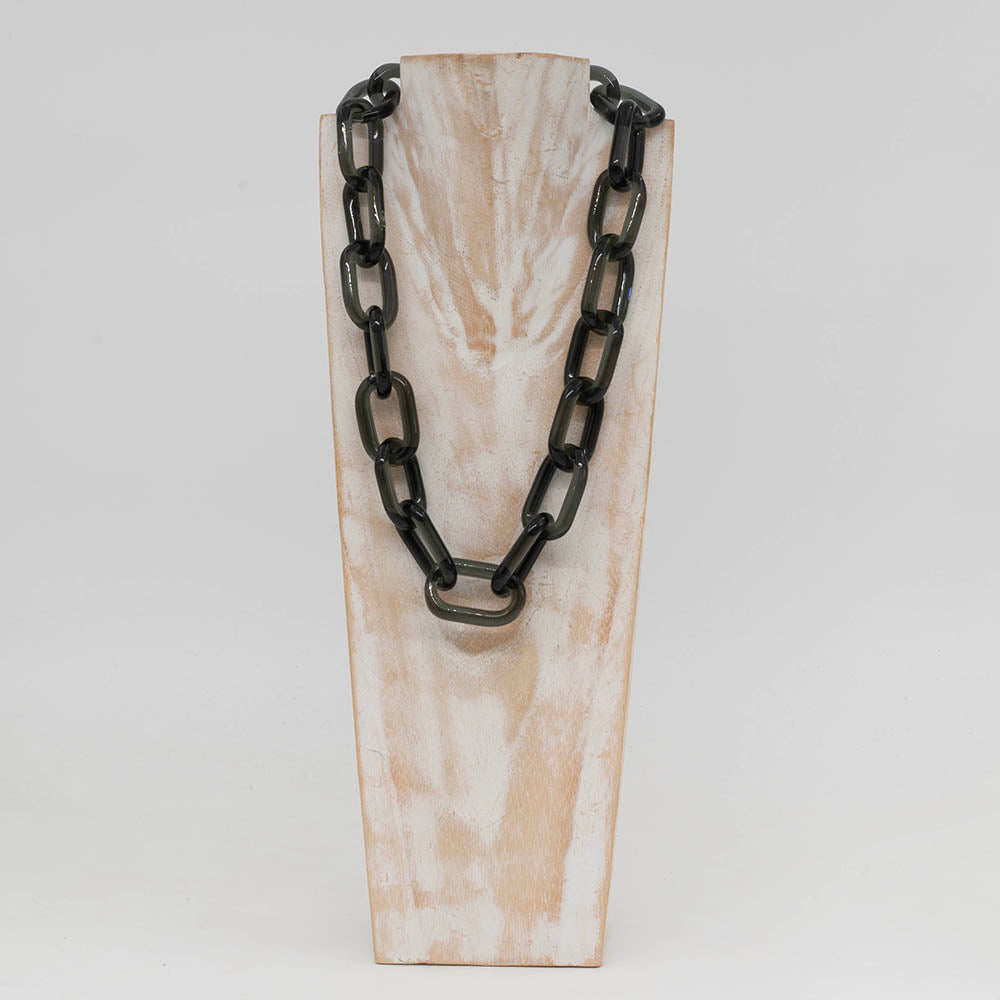 Front view of whitewashed wood torso displaying a necklace made from chunky transparent glass links
